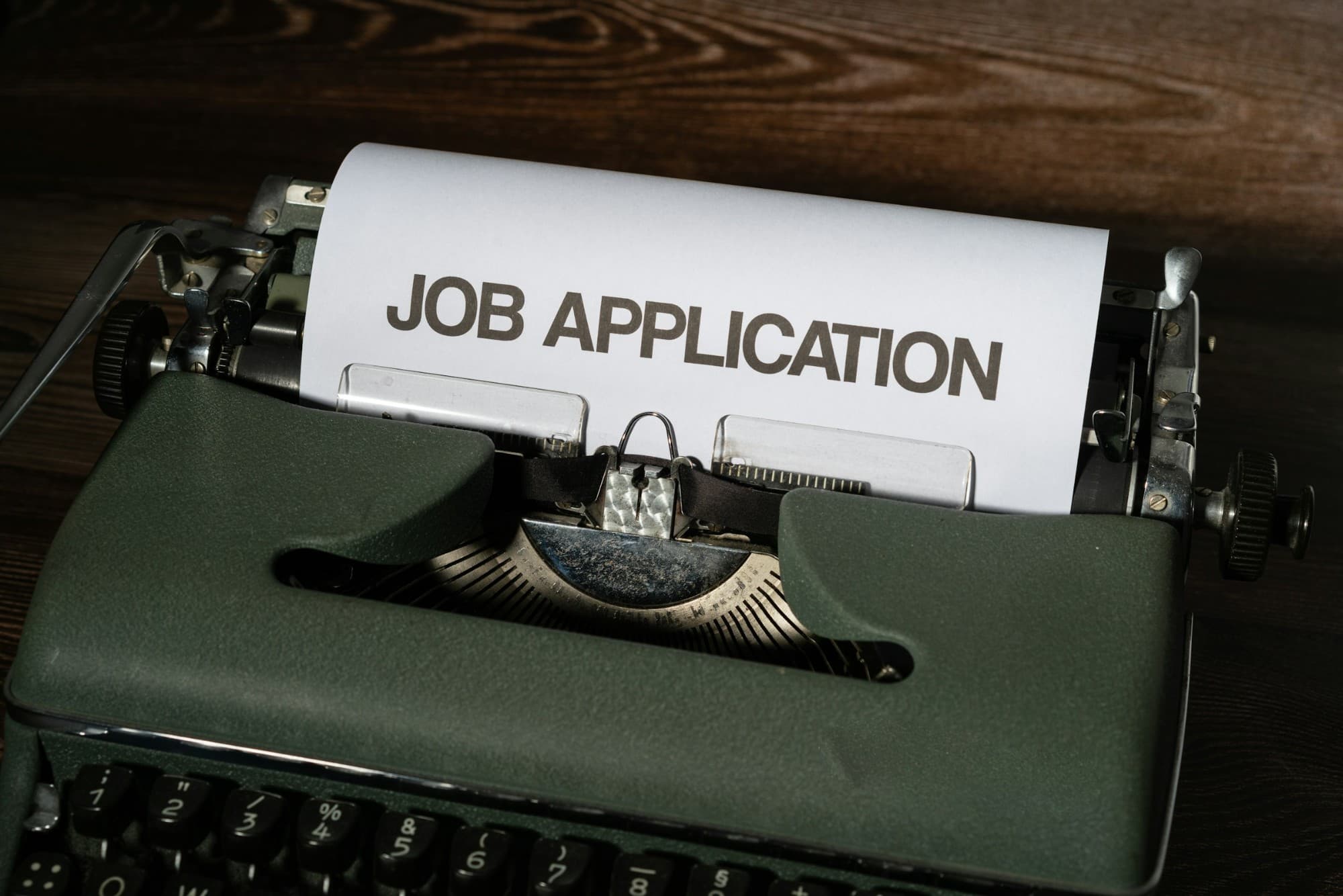 Vintage typewriter with JOB APPLICATION paper